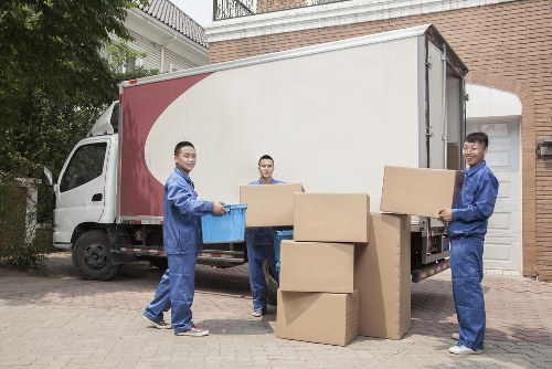 Van moving boxes outside a Brockley terrace house