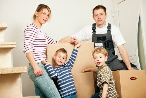 Business moving team organising desks and office equipment for a Brockley relocation